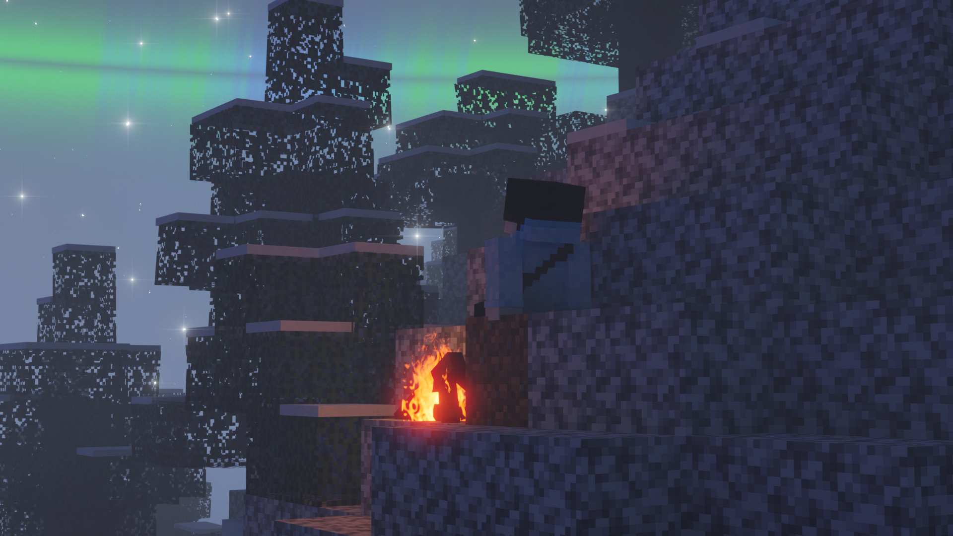 person on a mountain viewing an aurora